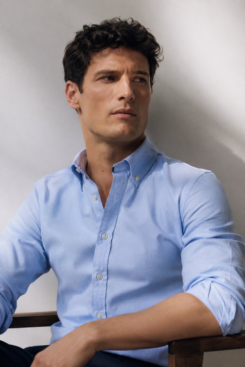 Man wearing a crisp light-blue oxford shirt