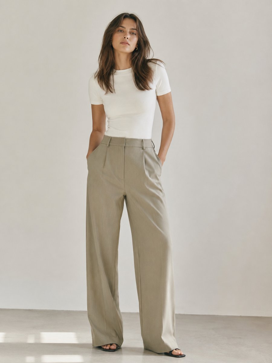 Woman in relaxed wide-leg tailored trousers with a fitted top