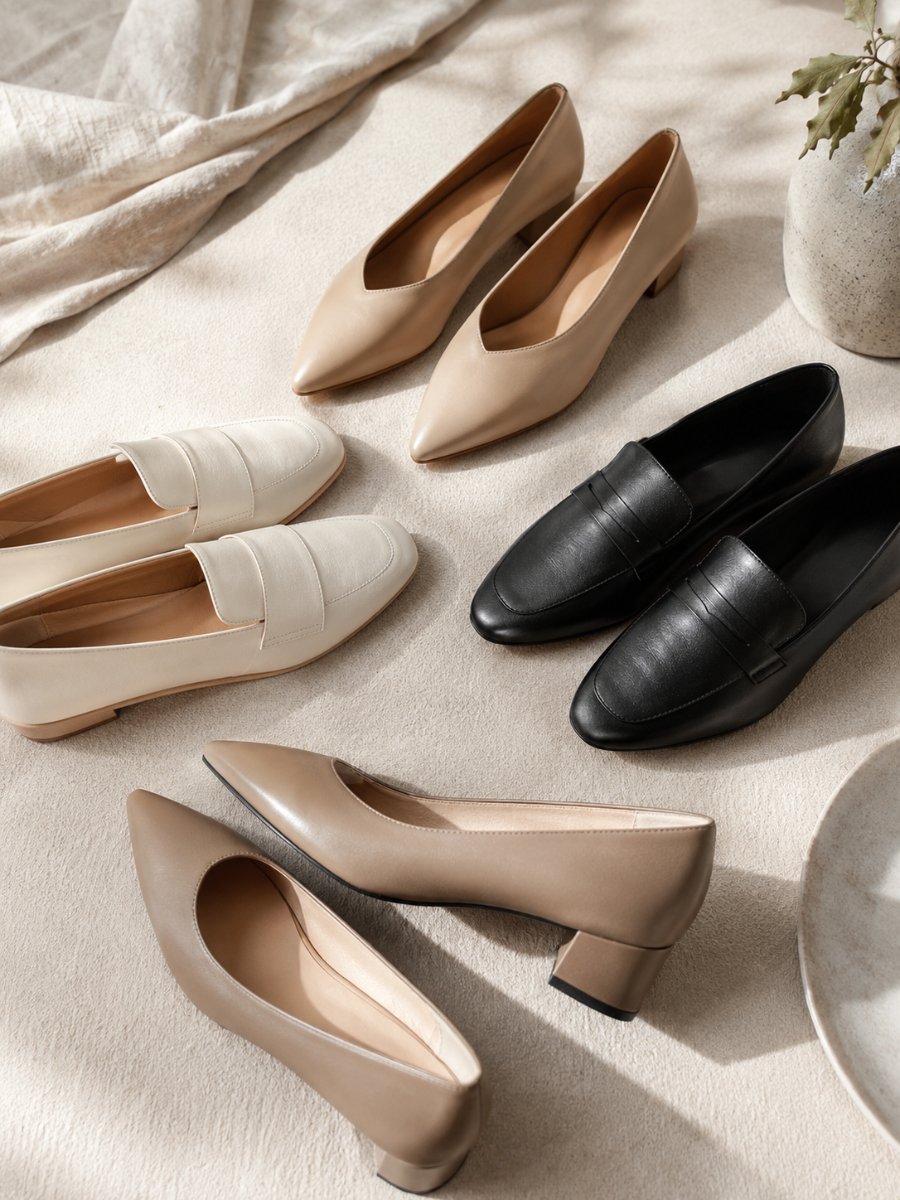 Flat lay of elevated flats, loafers and a low block heel