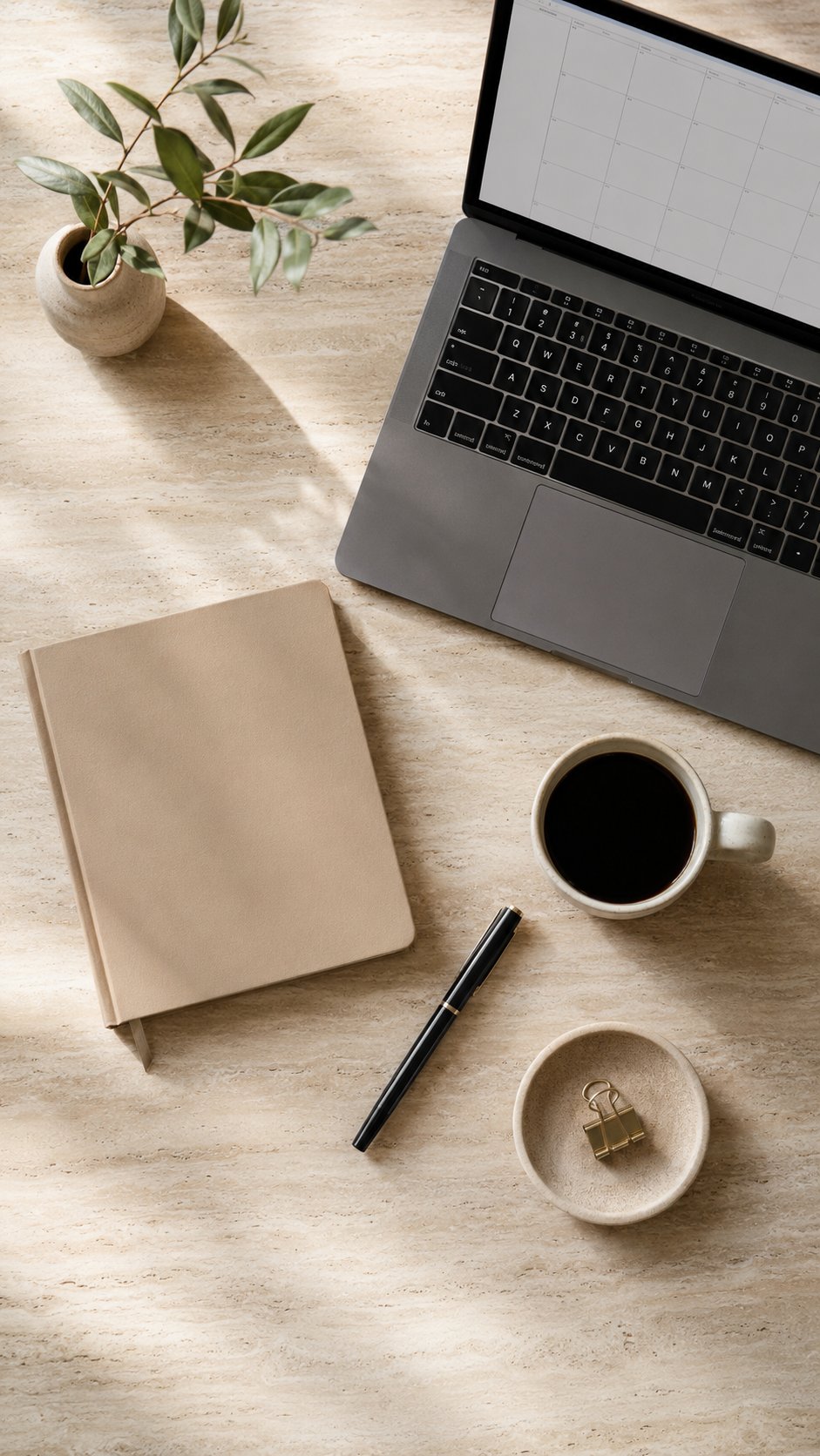 Calm productive founder reviewing the week at a clean desk, satisfied